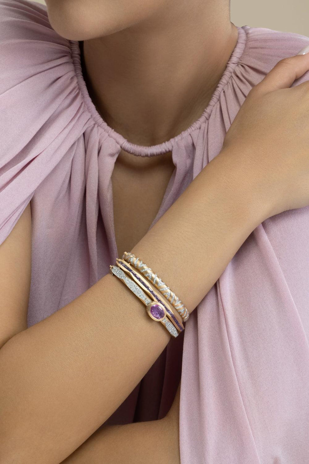 an image of a woman wearing a bracelet with pearls on it