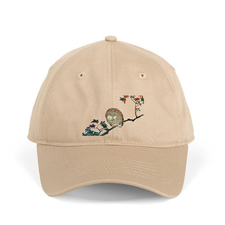 Oat organic cotton cap featuring a serene illustration of a sleeping horned owl (mimizuku) based on an Utagawa Hiroshige woodblock print. - Shop Now.