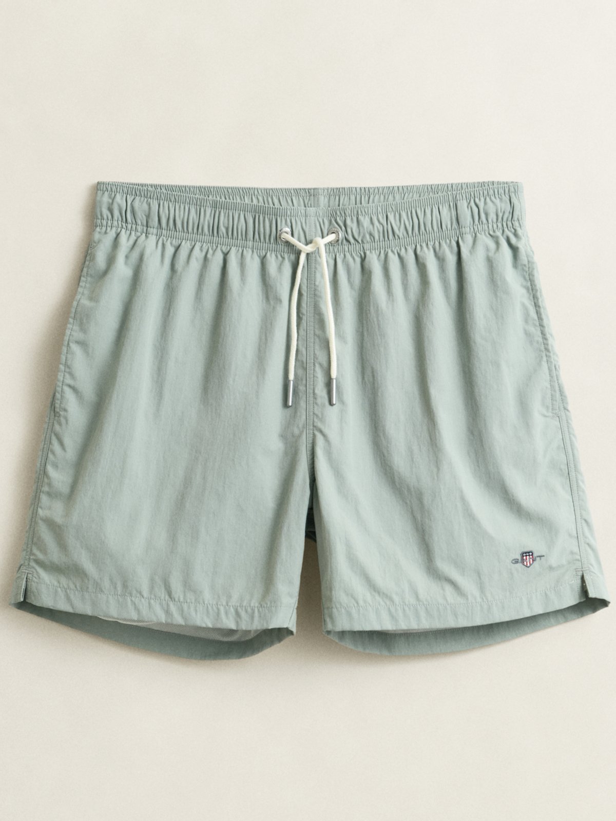 Swim trunks made from recycled material with label embroidery