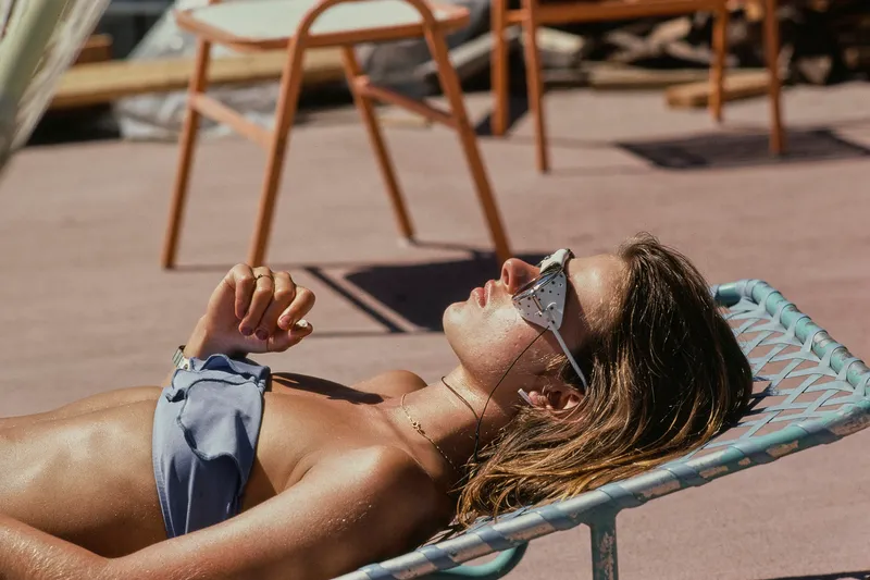 Image may contain: Nastassja Kinski, Sunbathing, Adult, and Person