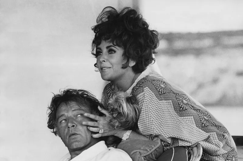 Image may contain: Richard Burton, Elizabeth Taylor, Face, Head, Person, Photography, Portrait, and Adult