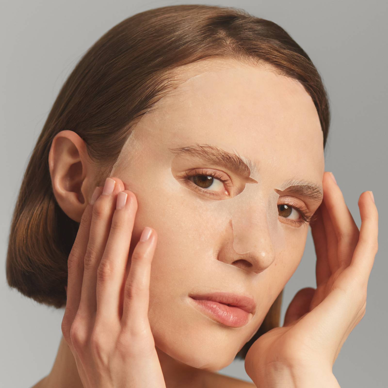 Woman wearing a sheet mask
