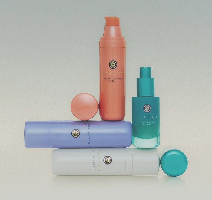 Tatcha serum formulas including the Dewy Serum, the Silk Serum, the Longevity Serum, and the Brightening Serum stacked on top of each other.