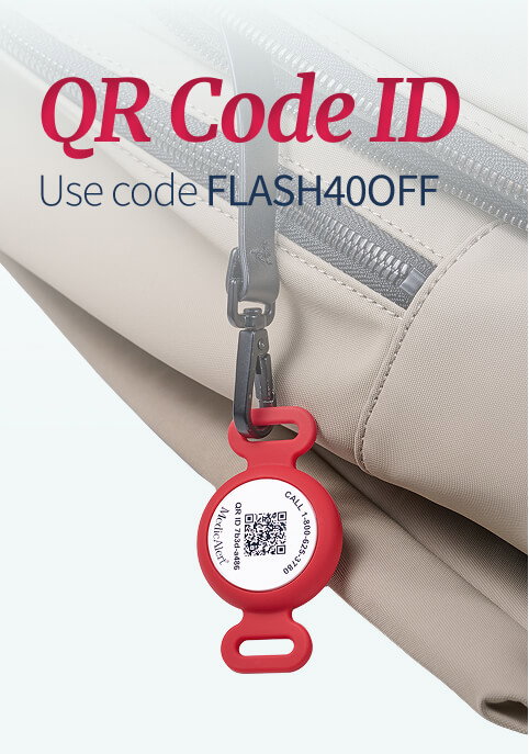 Close-up of a tan canvas bag, with a red silicone tag for a QR Code ID attached to a zipper with a small black clip. The round tag prominently displays a QR code and contact information. Dark red text in the top corner reads 'QR Code ID. Use code FLASH40OFF'.
