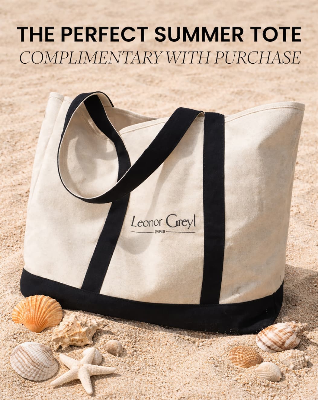 Leonor Greyl Summer Tote Bag on sand with seashells
