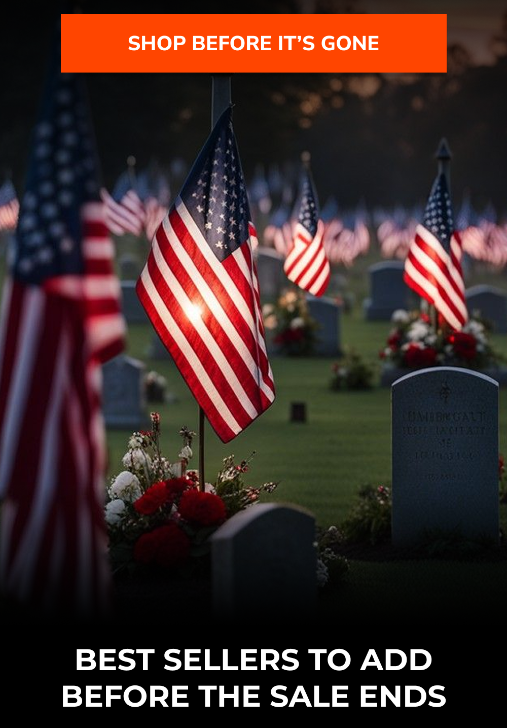 Flags on graves in a cemetery with flowers, illuminated by soft light.