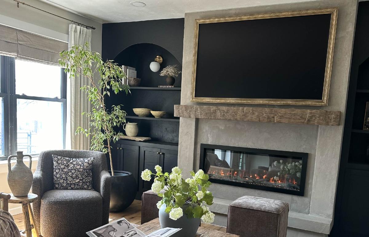 Modern living room with fireplace and large vases.