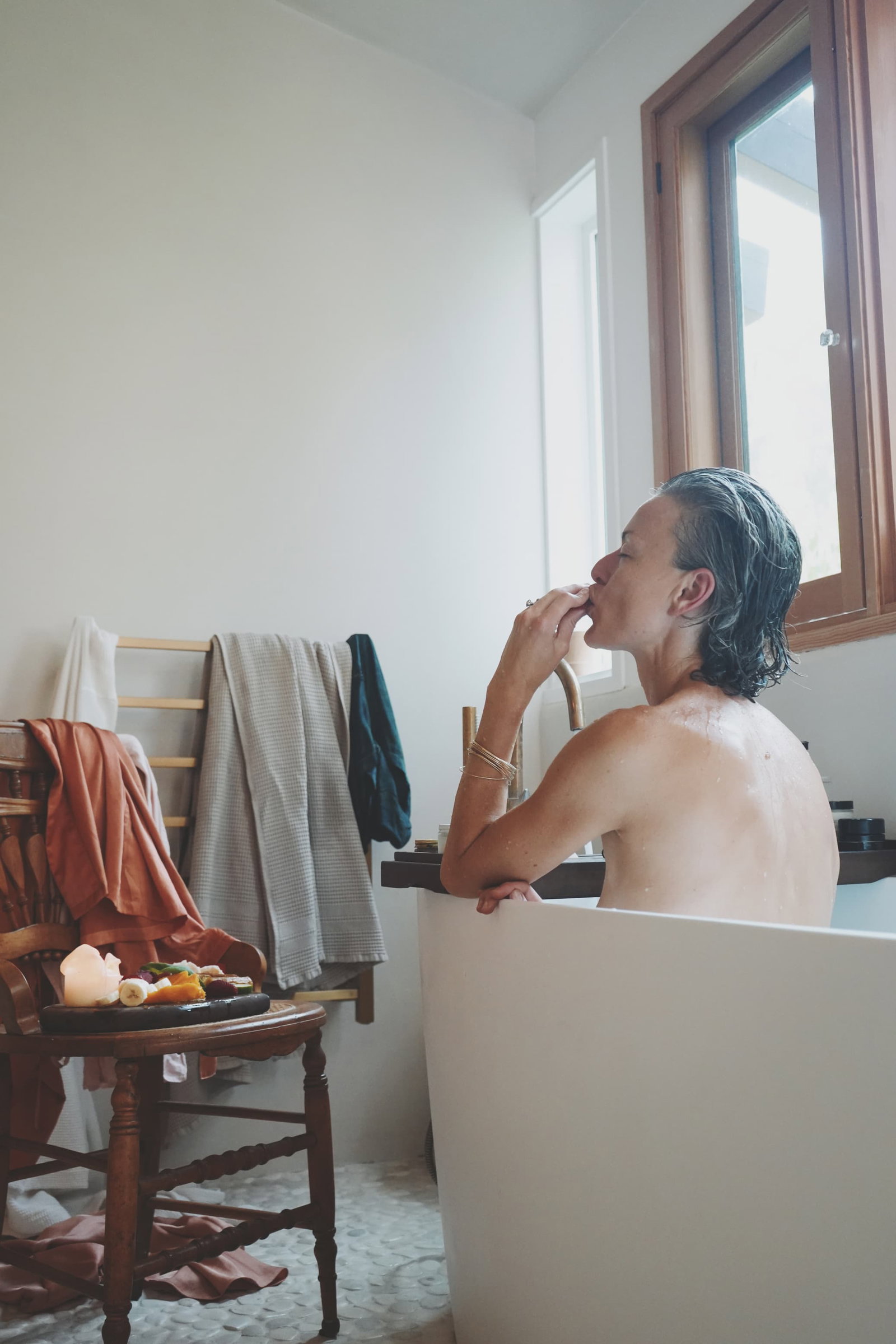 May in the bathtub with fruit