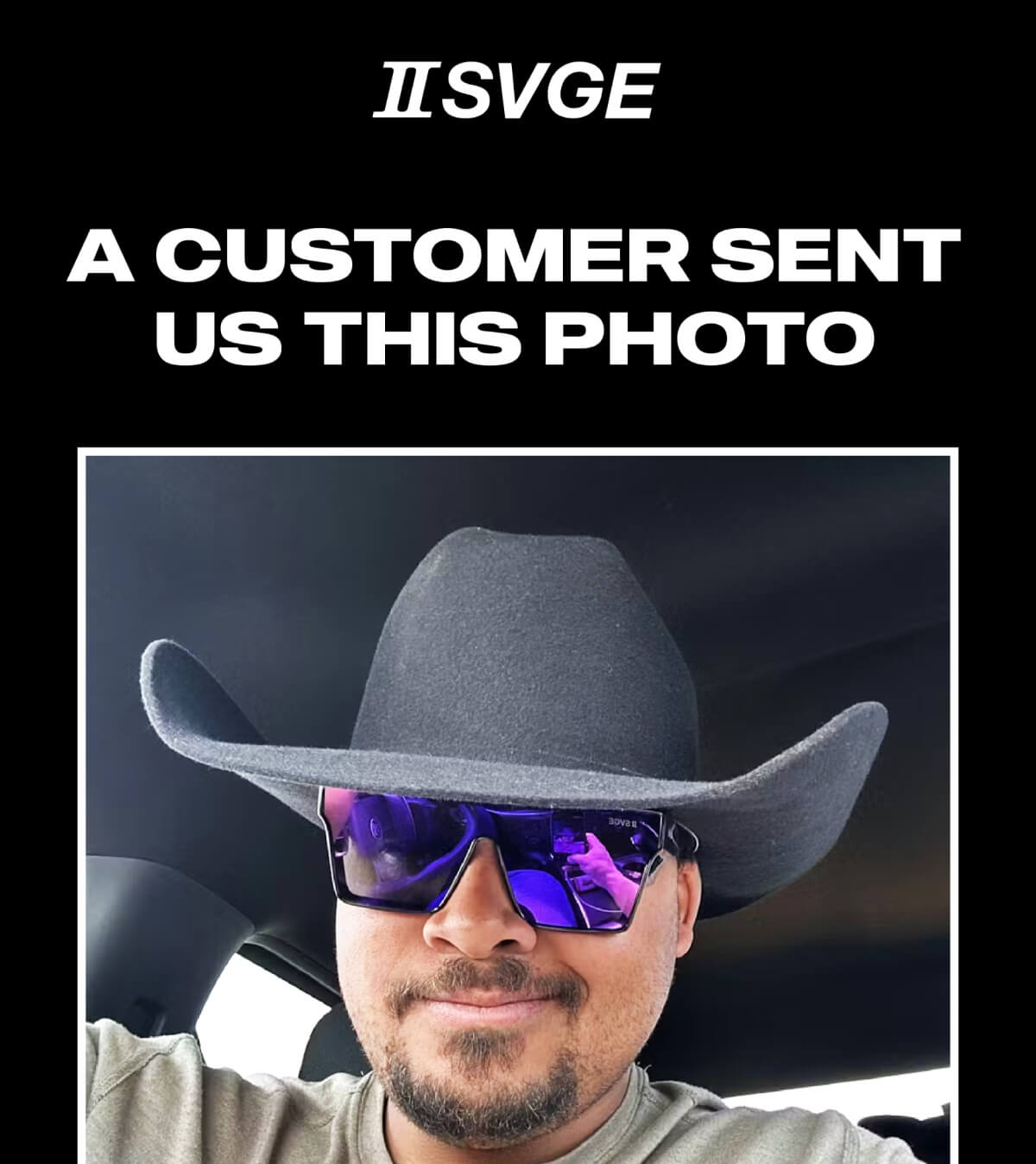 Man in grey cowboy hat and reflective sunglasses sitting in vehicle interior