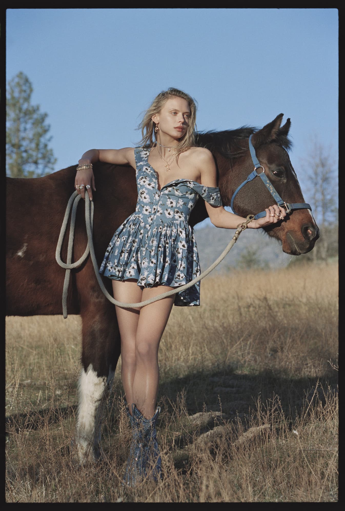 an image of a woman in a dress is posing for a picture