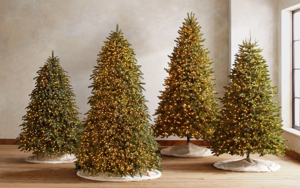 Grove of artificial Christmas trees displayed outdoors