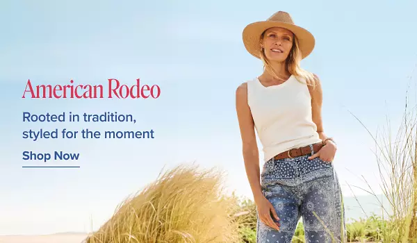 American Rodeo. Rooted in tradition, styled for the moment. Shop now. A woman in the beach in a cowboy hat and jeans and tank top.