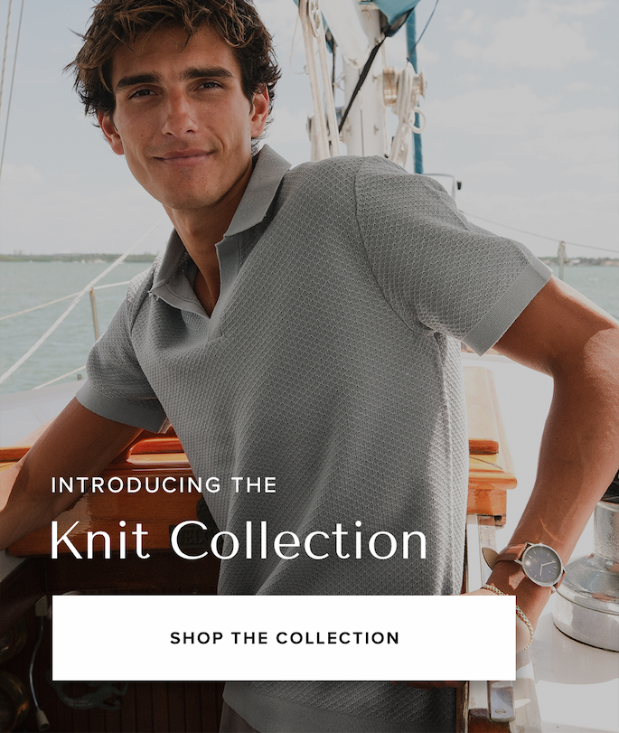 A man in a light blue textured knit polo shirt stands on a wooden sailboat with the ocean in the background. Text reads: 'Introducing the Knit Collection Shop the Collection'