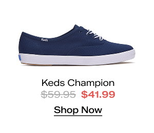 A side view of the Keds Champion Canvas Lace-Up in navy. The style was $59.95 and is now $41.99 for a limited time. Shop Now.