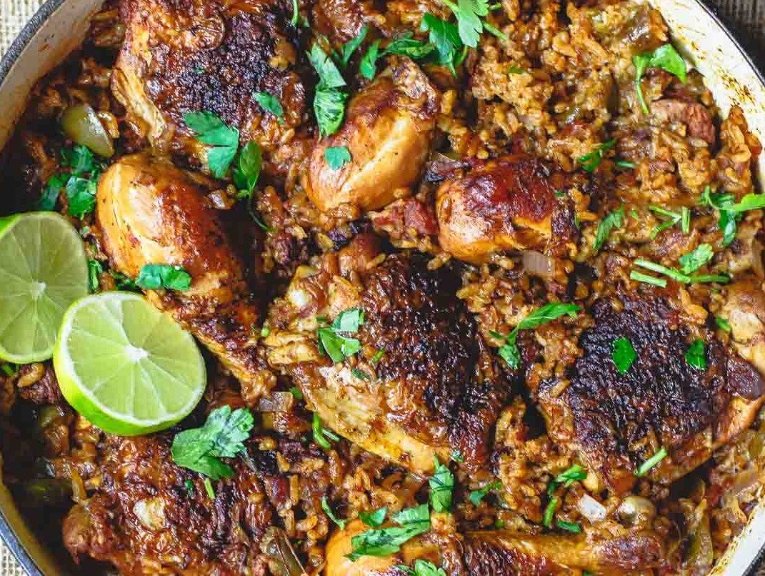 Spanish chicken and rice in a skillet.