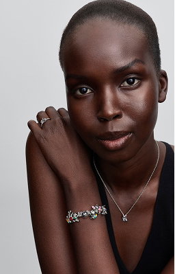 Model wearing Stitch charms on bracelet