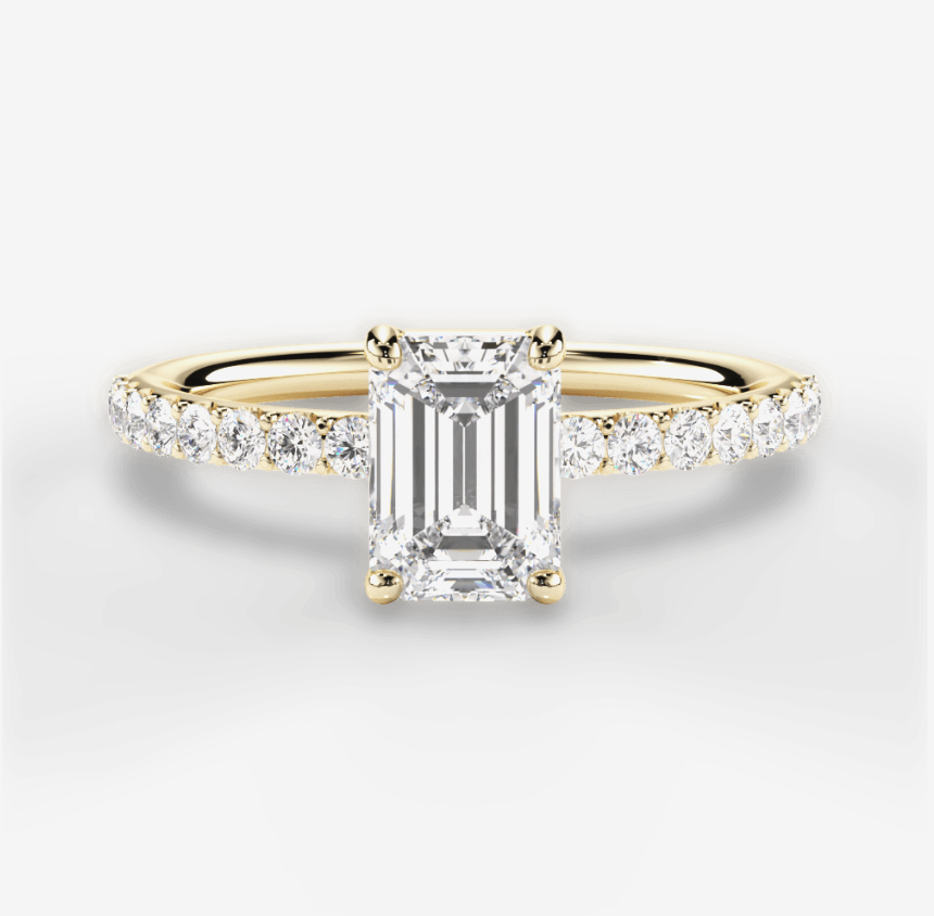 yellow gold diamond engagement ring with emerald center