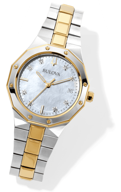 Two tone Bulova watch with gold and silver bracelet, mother of pearl dial, diamond markers, and date window.