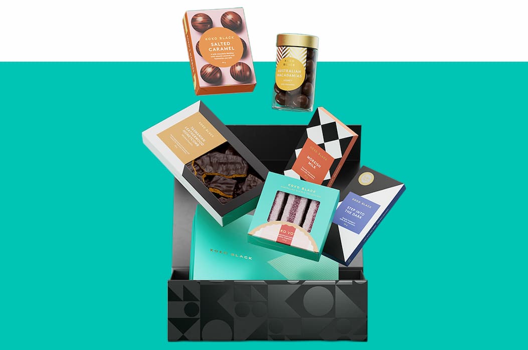 Hamper box with chocolate products floating above it