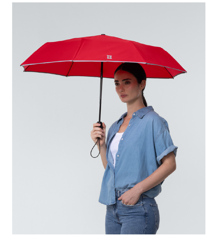 Woman using Travel Umbrella in Red