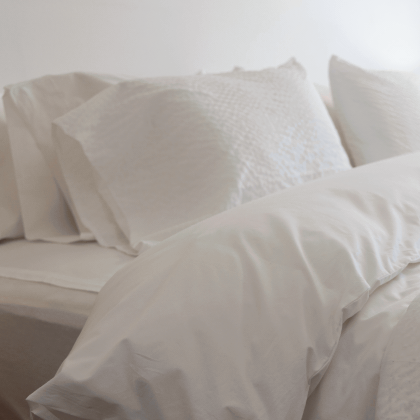 A woman makes her bed and sleeps in it