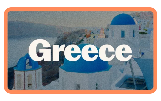Coral-orange border, 'Greece' white bold text, Santorini white buildings, bright blue church domes, Cycladic architecture, grey-blue sea, coastal hillside, muted sky and a Mediterranean landscape.