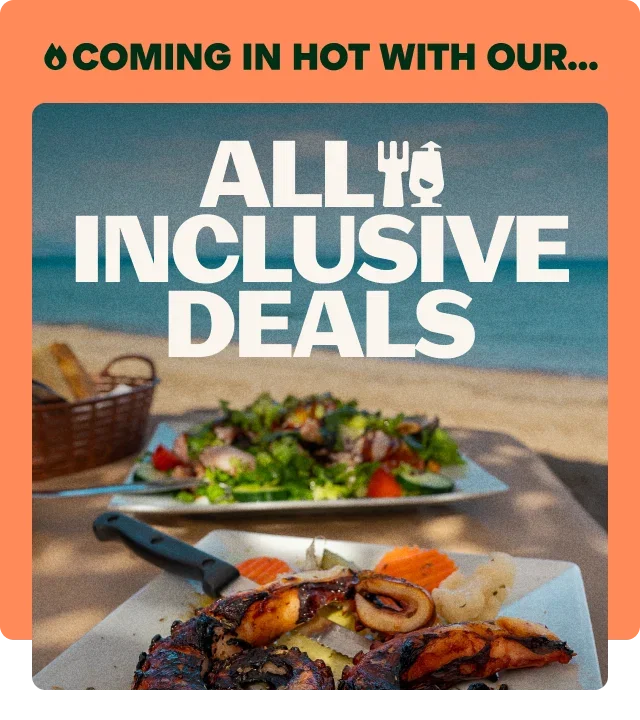 Coral-orange border, flame emoji, 'COMING IN HOT WITH OUR' dark green text, 'ALL INCLUSIVE DEALS' white bold text with fork and wine glass icons, grilled seafood and chicken on white plate, garden salad on blue plate, woven bread basket, ocean background and beachside dining.