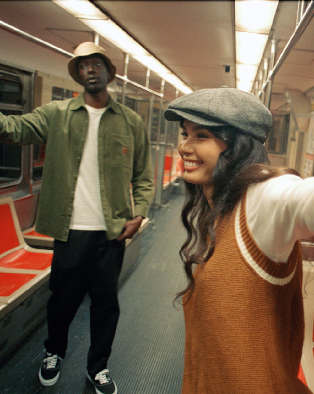 2 Young Brixton Wearing individuals riding the subway