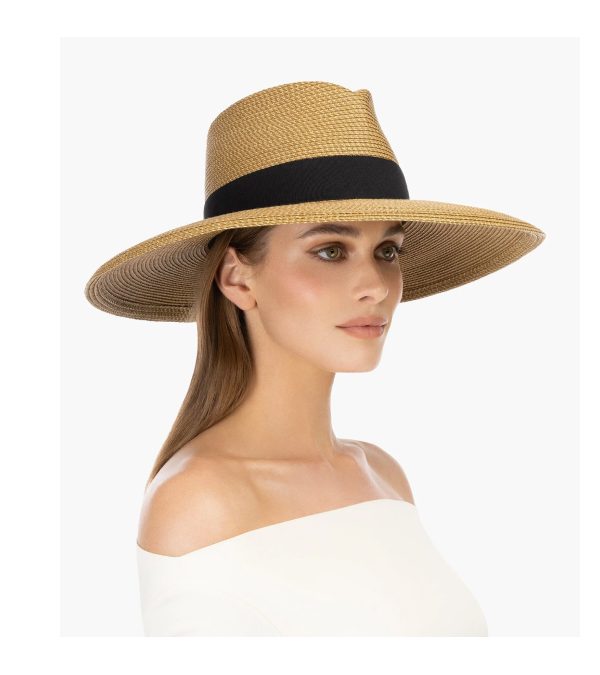 A woman wearing a wide-brimmed straw hat with a black band, looking to the side.