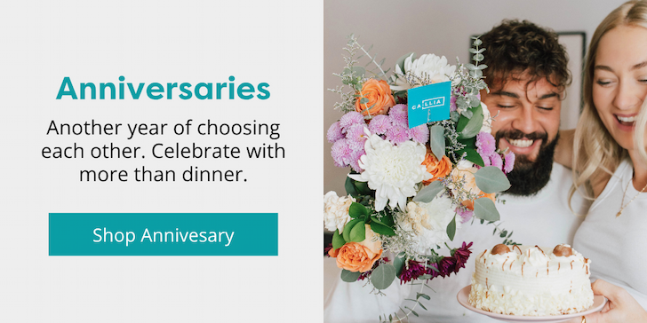Couple celebrating an anniversary with a Callia bouquet and cake 