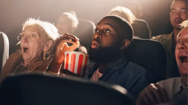People watching screen with popcorn