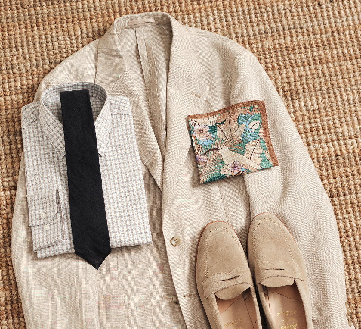 Lean into rich earth tones with a checked dress shirt, Italian-made pocket square, and our Navy French Linen Tie for texture that feels cohesive and refined.