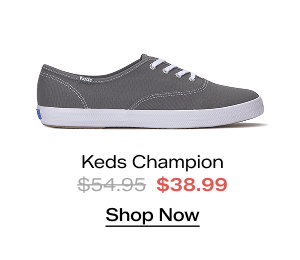 A side view of the Keds Champion Canvas Lace-Up in gray. The style was $54.95 and is now $38.99 for a limited time. Shop Now.