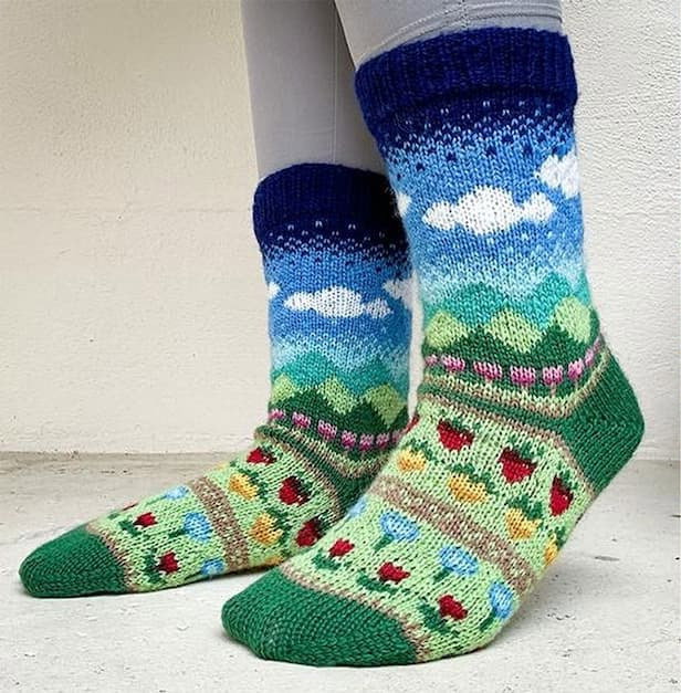 A pair of knit socks with the Stardew Valley print. >>