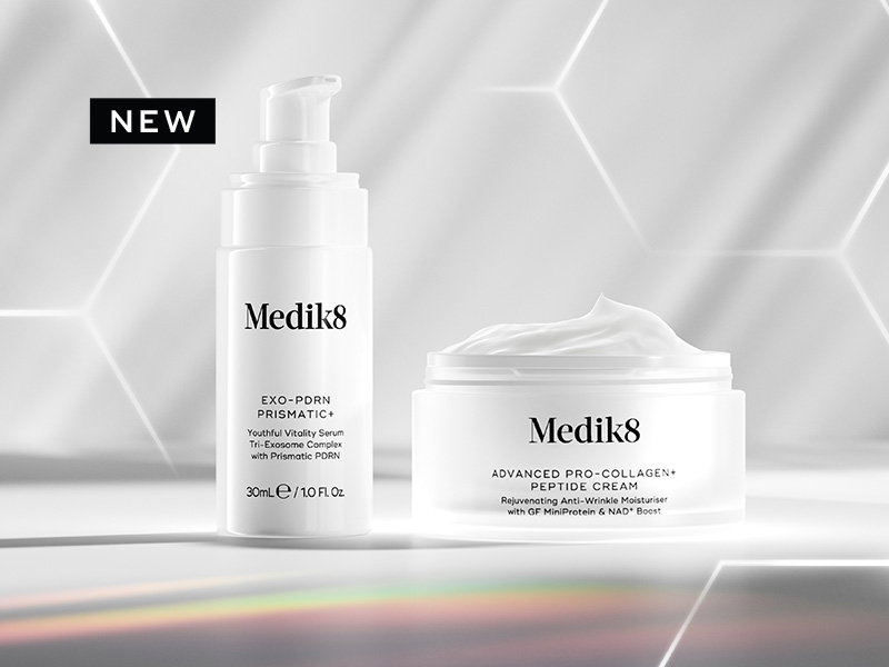 Exo-PDRN Prismatic+ Youthful Vitality Serum shown beside Advanced Pro-Collagen+ Peptide Cream with a ‘NEW’ label on a soft iridescent background.