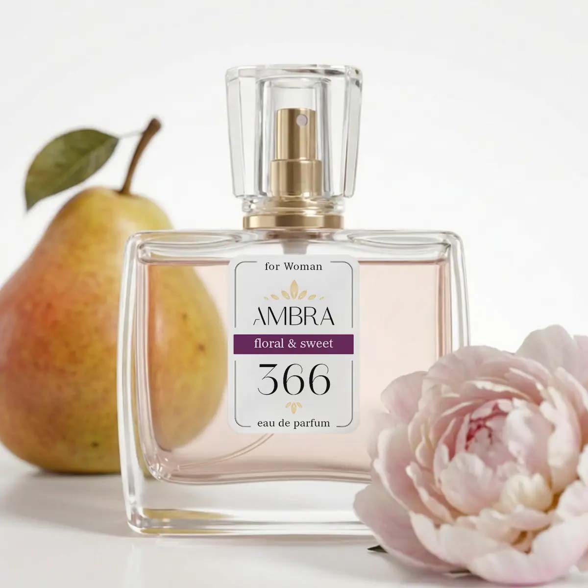 Glass bottle of Ambra 366 floral & sweet eau de parfum for women, with a ripe pear and pink peony flower beside it