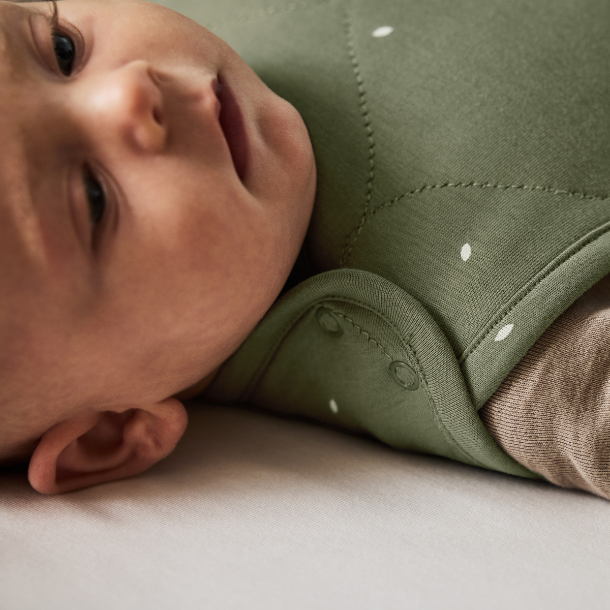organic quilted baby sleeping bag in juniper with sage - 1.0 tog