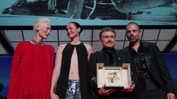 Left to right: Tilda Swinton poses with Renate Reinsve, Cristian Mungiu and Sebastian Stan during the awards ceremony at the 79th Cannes International Film Festival.