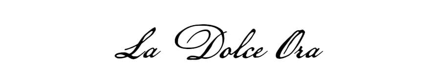 The words 'La Dolce Ora' are displayed in a black, elegant script font against a plain white background.