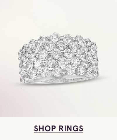 Thick silver ring with multiple rows of round diamonds, creating a 
