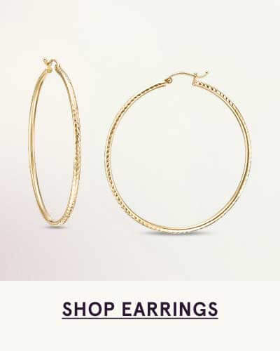 Large, dainty gold hoop earrings. Click here to shop earrings