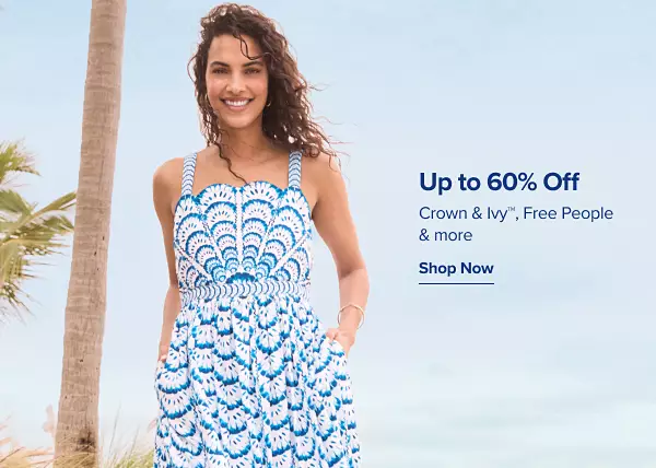 Up to 60% off Crown and Ivy, Free People and more. A woman in a vibrant blue print dress.