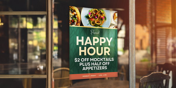 A green 'Happy hour' poster hangs outside a restaurant window.