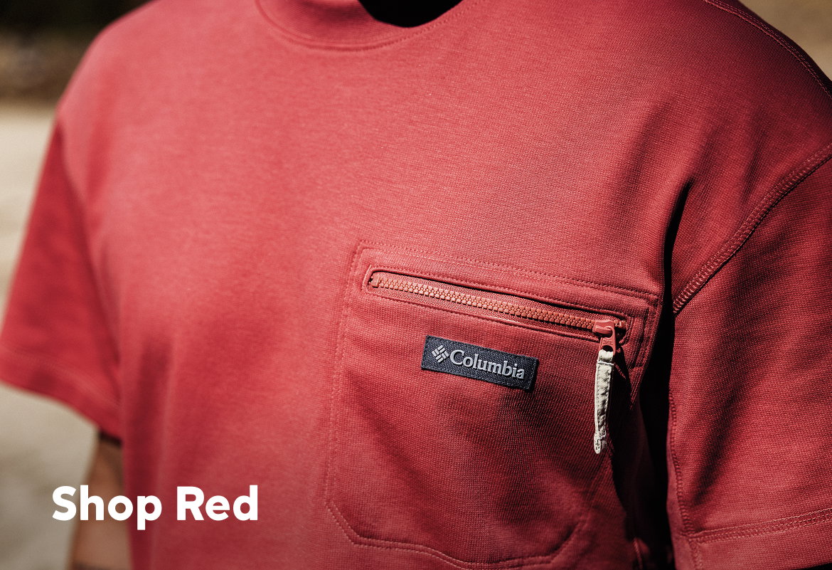 Close up of man wearing red Columbia shirt with zippered chest pocket.