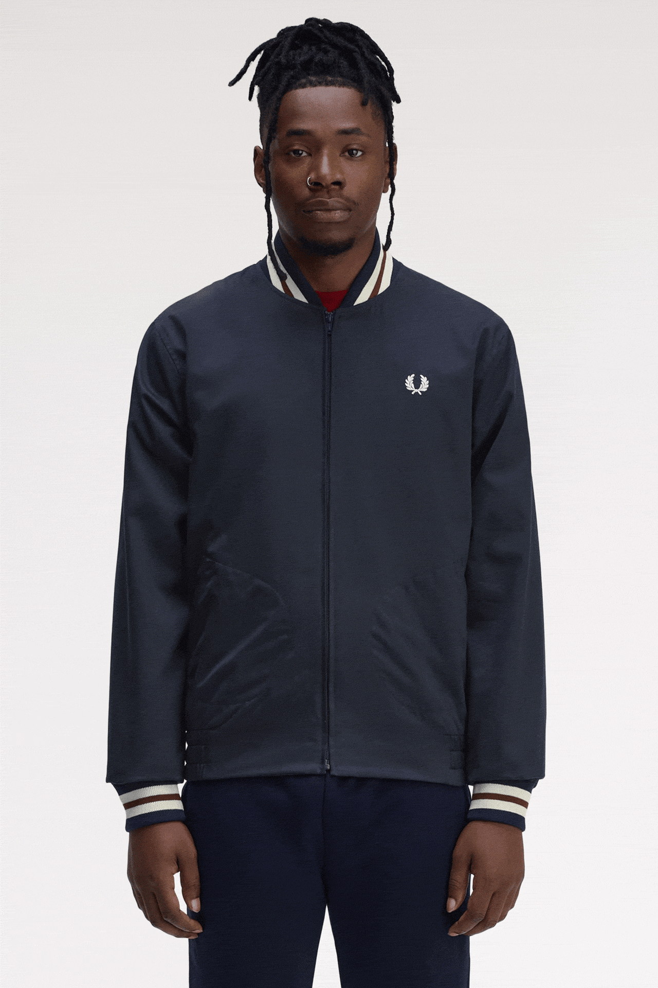 GIF of a male model wearing the Fred Perry Twill Tennis Bomber Jacket