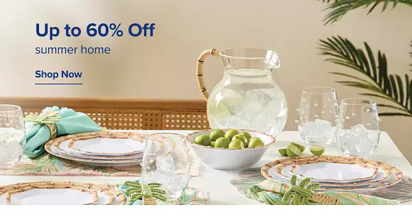 Up to 60% off summer home. Shop now. A set table with decretive dishware on it.