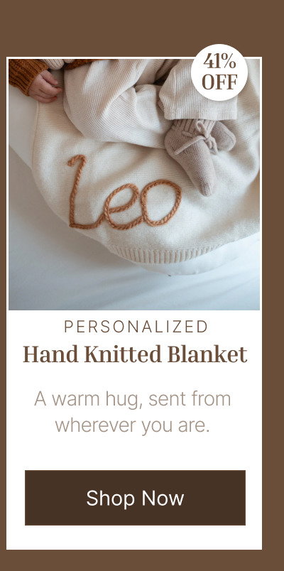 Personalized knit blanket with the name Leo embroidered in brown thread on a soft cream fabric background.