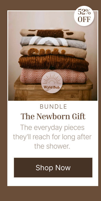 Folded neutral knit blankets stacked beside soft nursery fabrics and warm brown textile textures.