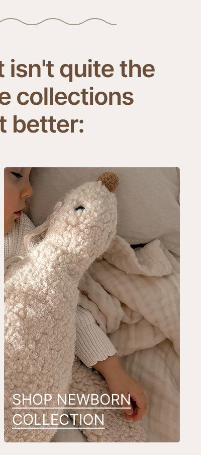 Large cream plush teddy bear resting on a soft blanket beside neutral nursery textures and bedding.