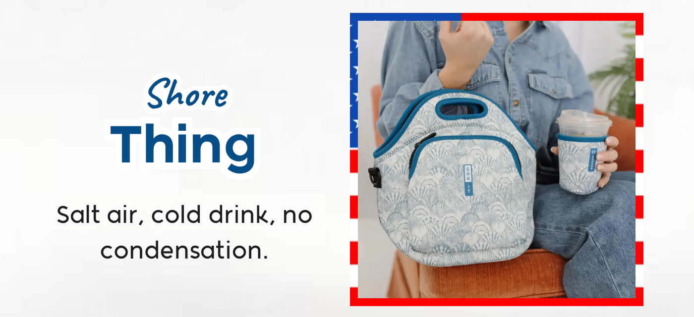 Person holding a patterned cooler bag and insulated tumbler designed for cold drinks on the go.